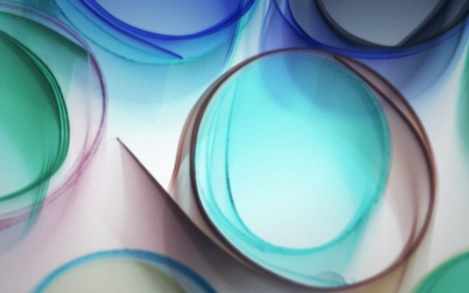 Layered translucent acetate sheets on a lightbox